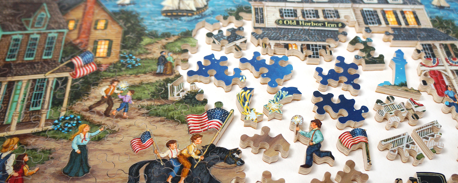 Wooden patirotic jigsaw puzzle depicting a town back when there were dirt roads connecting the town and people travelled by horseback and carriage.